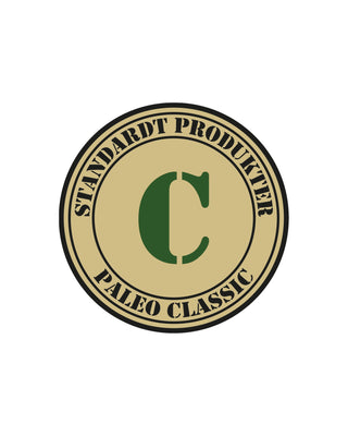 Logotyp för Hundinspiration Standardt Paleo Classic med ett grönt C i en beige cirkel.